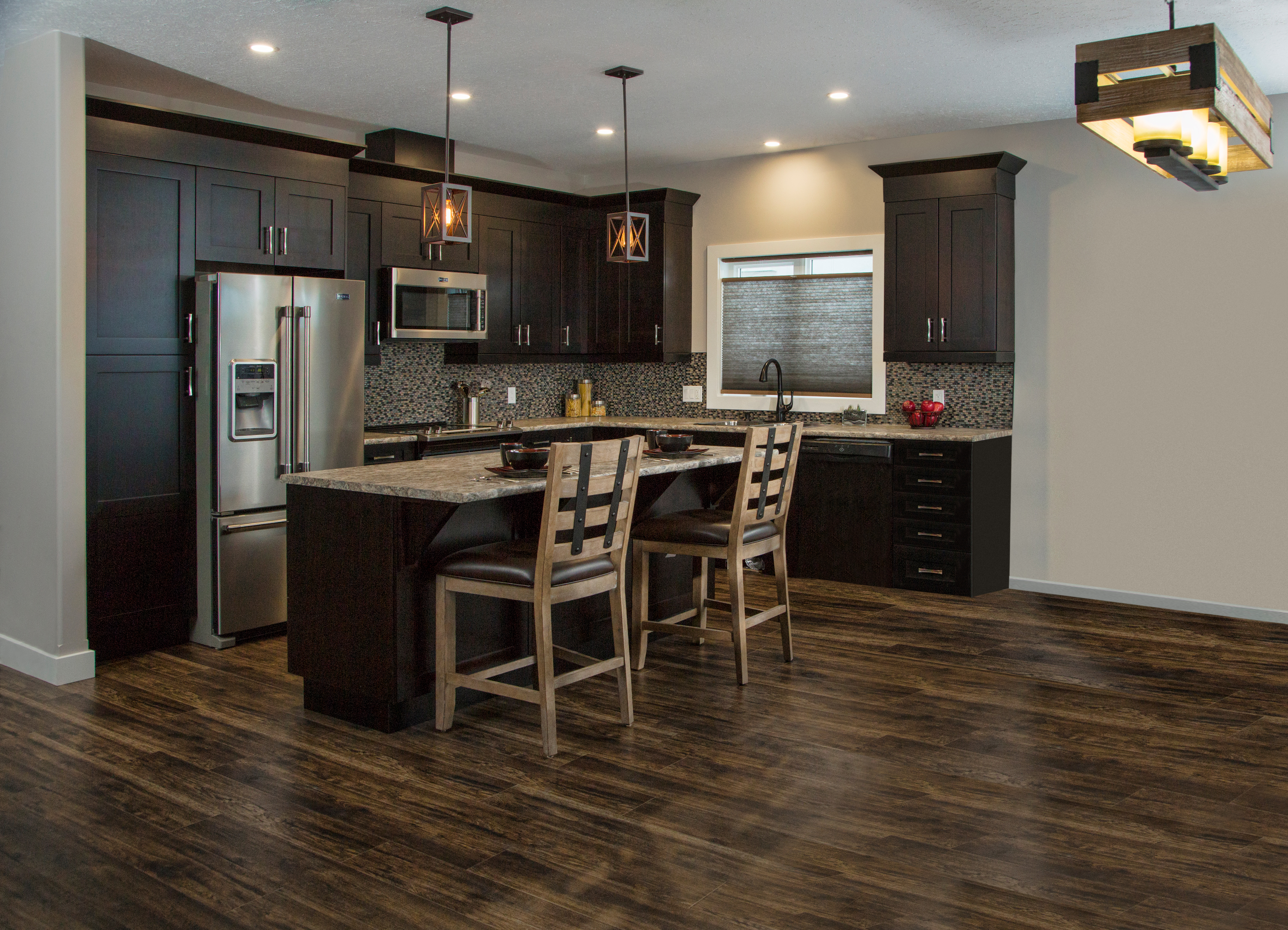 Kitchen with hardwood flooring and dark cabinets